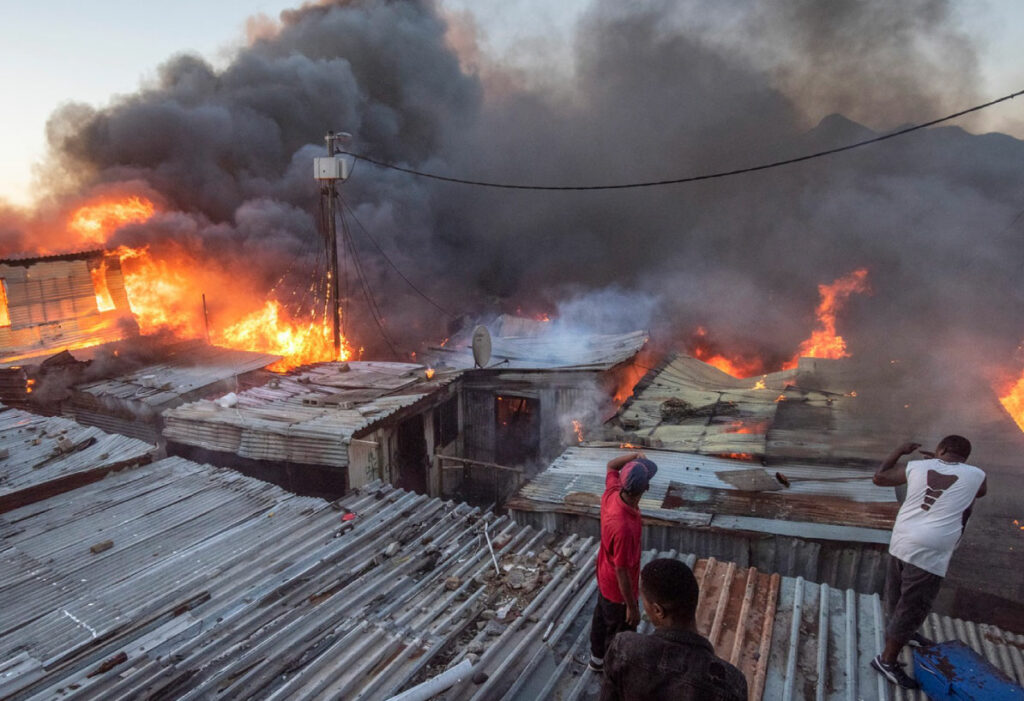 Hundreds of people left homeless after fire tears through informal ...